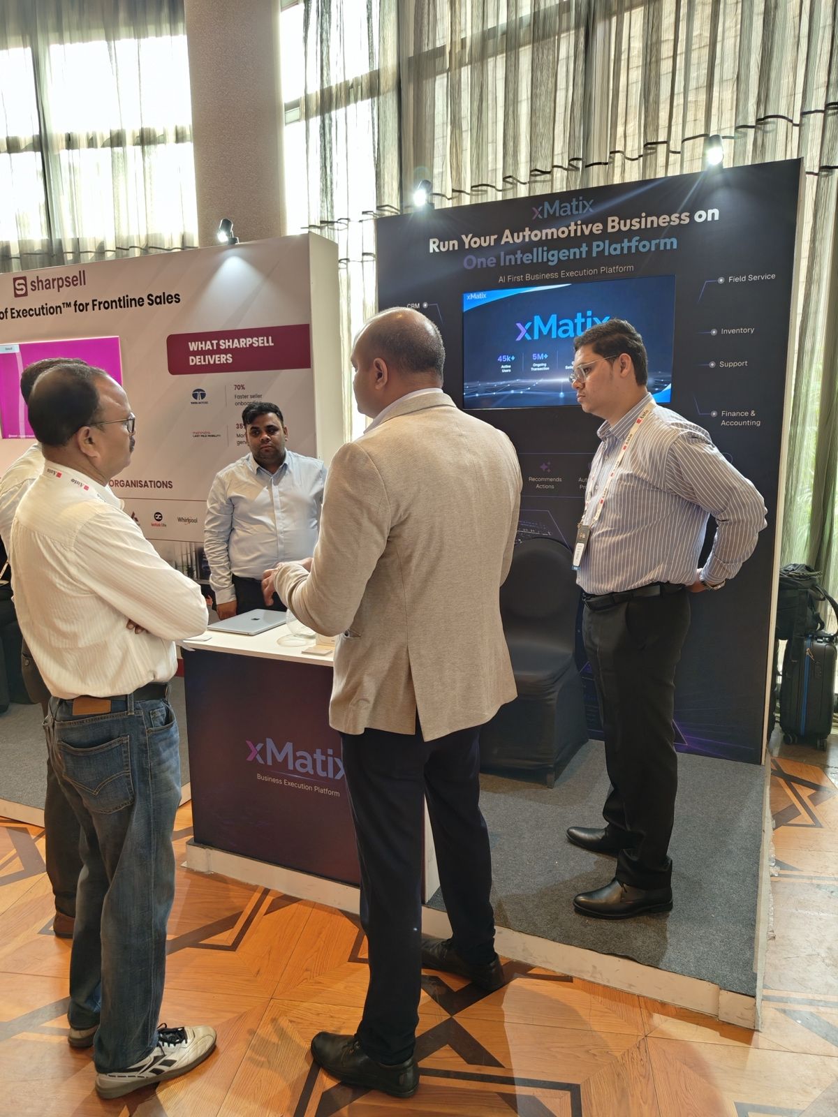 Visitors in discussion at the xMatix stall